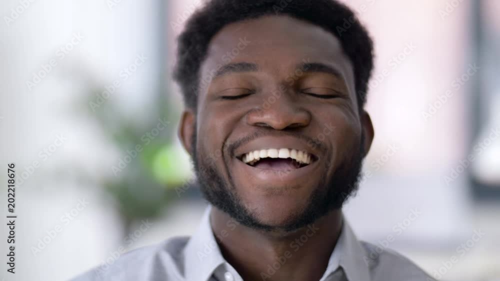 business and people concept - portrait of laughing african american man business and people concept - portrait of laughing african american man