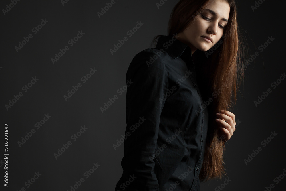 Sad girl on a black background Sad girl on a black background