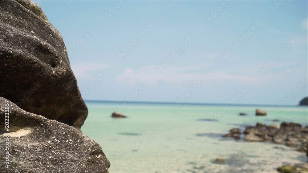 Large rocks in the ocean. Large stones on the beach in the sea. Large rocks in the ocean. Large stones on the beach in the sea.