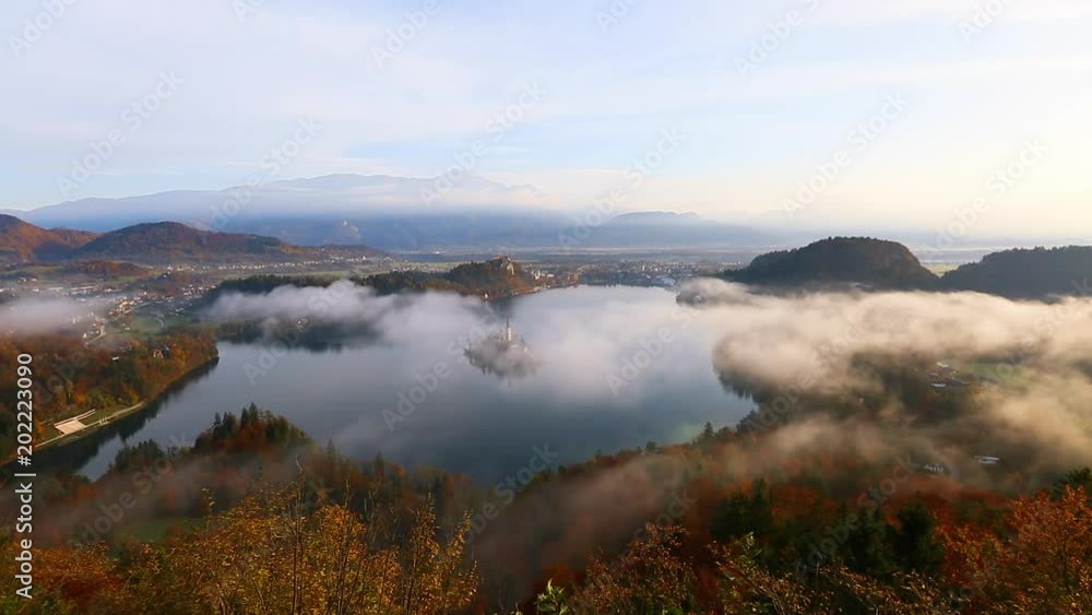 Aerial view of the foggy alpine lake Bled. Location Julian Alps, Slovenia, Europe. Aerial view of the foggy alpine lake Bled. Location Julian Alps, Slovenia, Europe.