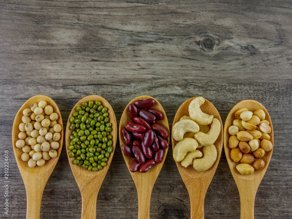 Flat lay various beans on wooden table with copy space Food,ingredients,nature concept Flat lay various beans on wooden table with copy space Food,ingredients,nature concept