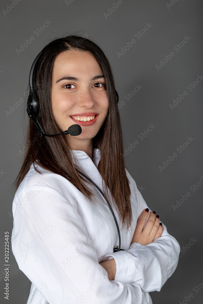 Beautiful smiling Turkish female call center girl on the job Beautiful smiling Turkish female call center girl on the job