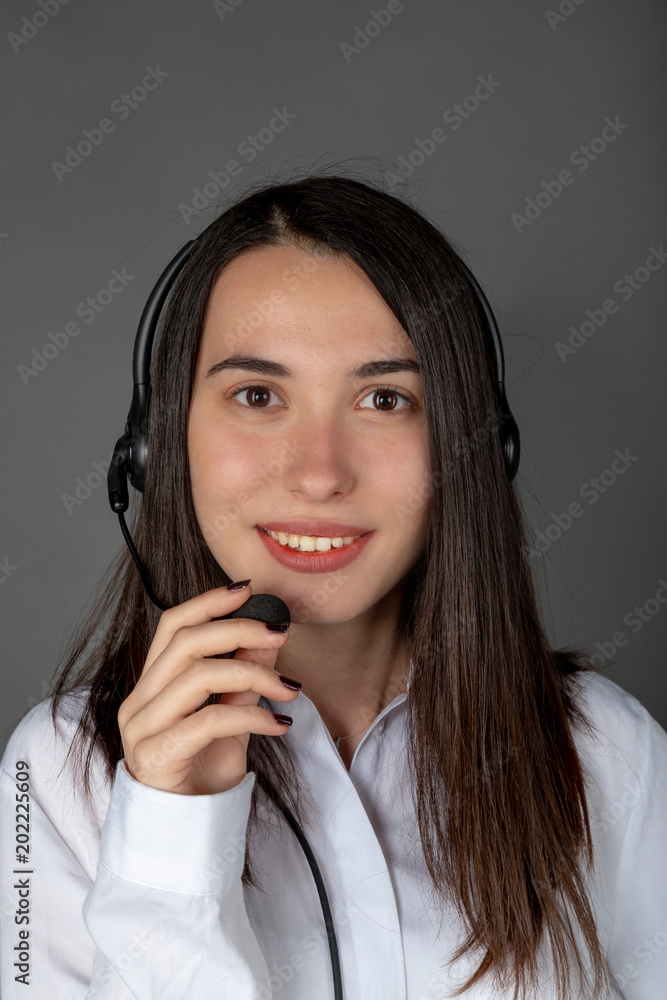 Beautiful smiling Turkish female call center girl on the job Beautiful smiling Turkish female call center girl on the job