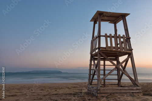 A lifeguard tower on the mediterranean beach at sunset © Paopano