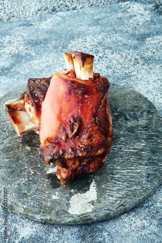 Roasted pork knuckle. Ham and bacon are popular foods in the west. German Schweinshaxe or Haxe