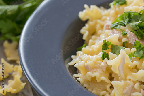 Close up of mafalda pasta with tuna and parsley. photo