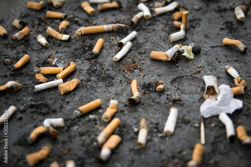 Cigarette butts, smoking hurts health.