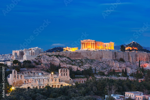 Fototapeta Naklejka Na Ścianę i Meble -  Aerial view of the Acropolis Hill, crowned with Parthenon during evening blue hour in Athens, Greece
