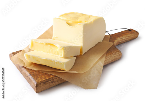 pieces of butter on wooden cutting board photo