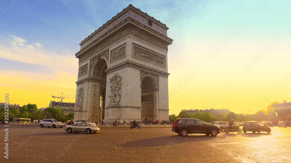 Paris, France - 5 May, 2017: Sunset in Paris city with famous Arch de Triumph traffic circle panorama