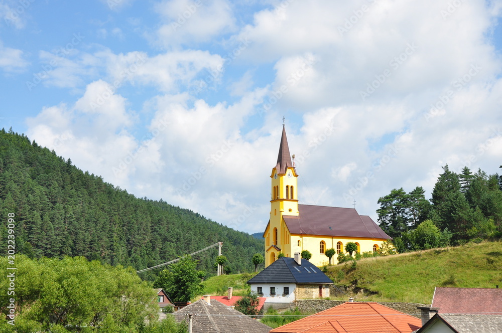Slovakian village with a yellow church, Smolnicka Huta, Slovakia Slovakian village with a yellow church, Smolnicka Huta, Slovakia
