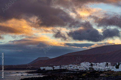 White houses of Arrieta, small village north Lanzarote island, sunset photo
