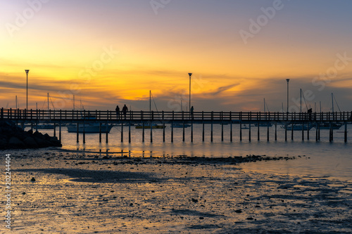 Harbor view of a pier at sunset