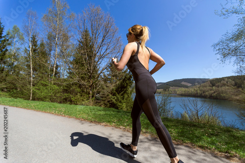 female runner in action in spring