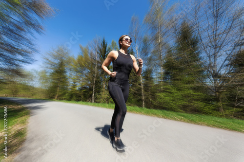 female runner in action in spring