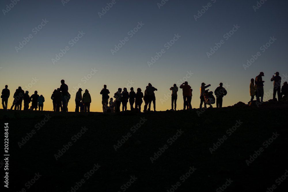 silhouette of photographers waiting for the sun to set silhouette of photographers waiting for the sun to set