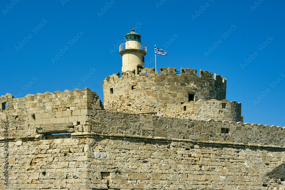 Lighthouse and medieval castle of St. Nicholas on the island of Rhodes.