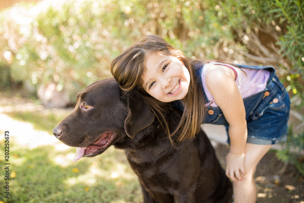 Little child smiling with dog