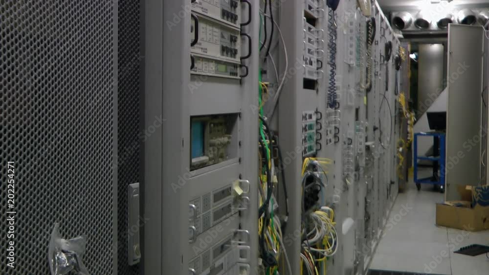 Inside telecom server room, tilt up. Inside telecom server room, tilt up.