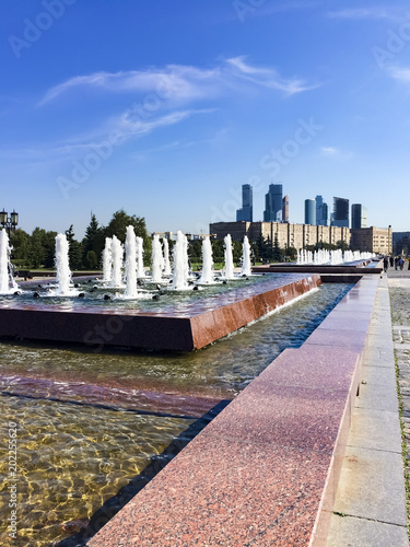 Moscow, Russia - August 06, 20177: Skyscraper towers of the Moscow international business center. The fountain in Victory Park on Poklonnaya hill photo