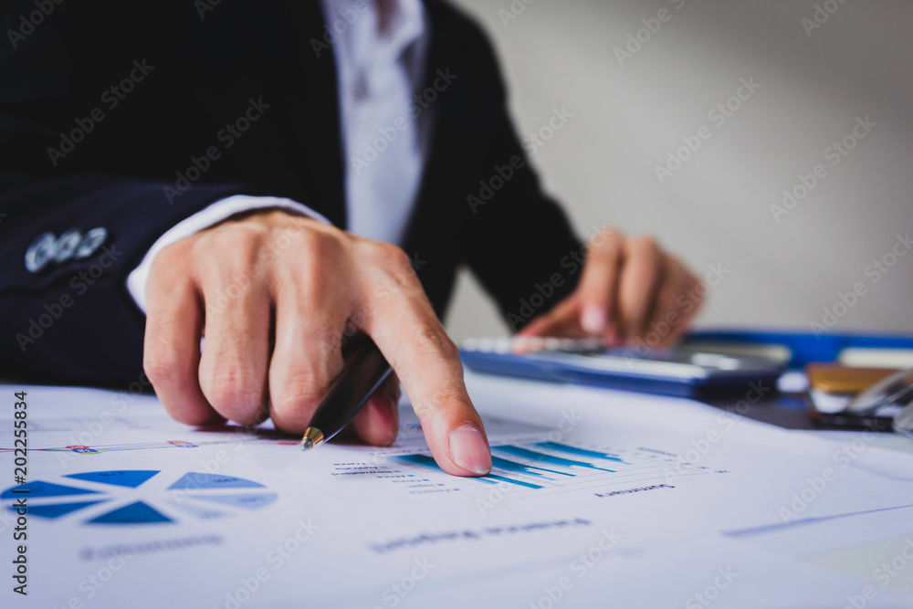 Businessman calculate about cost and doing finance at office, Finance managers task. Businessman calculate about cost and doing finance at office, Finance managers task.