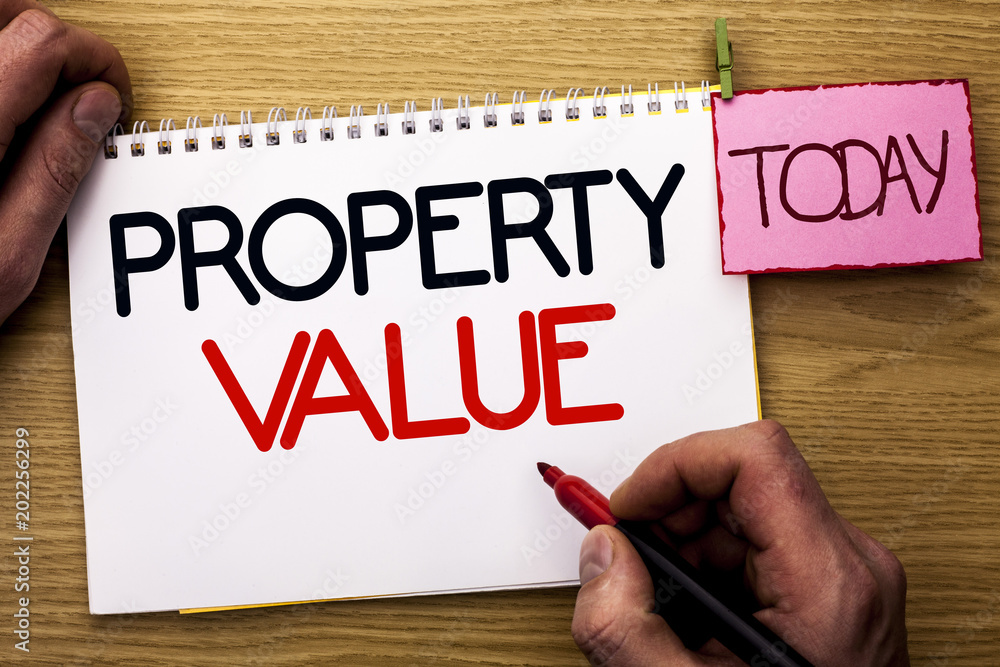 Word writing text Property Value. Business concept for Estimate of Worth Real Estate Residential Valuation written by Man on Notebook Book Holding Marker on the Wooden background Today. Word writing text Property Value. Business concept for Estimate of Worth Real Estate Residential Valuation written by Man on Notebook Book Holding Marker on the Wooden background Today.