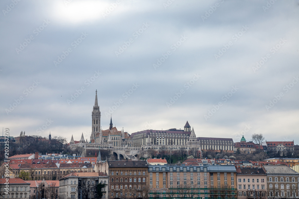Buda Castle seen from Pest with the Matthias Church in front.  The cast is the historical palace complex of the Hungarian kings 