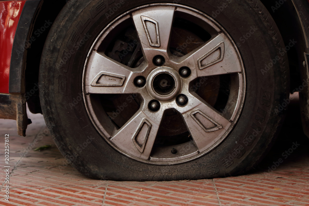 Punctured wheel in old car