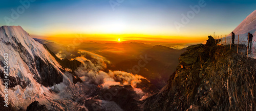 Panoramic view of the sunset over the Alps from Refugee du Gouter hut while climbing of Mont Blanc