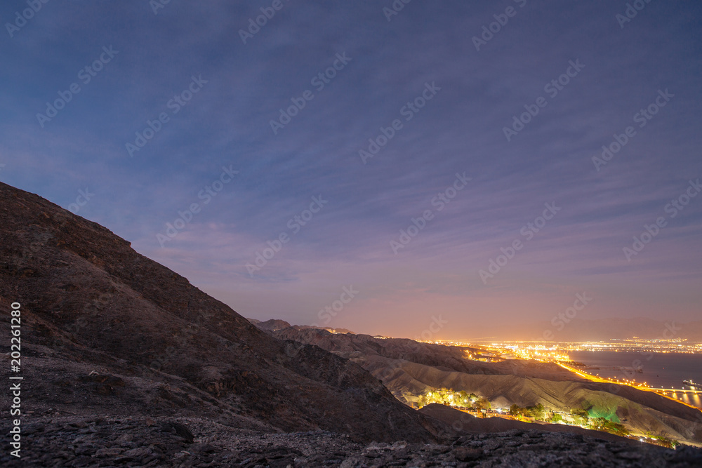 Suburb of Eilat city in the desert  in the Israil in the evening  with blue sky and city lights