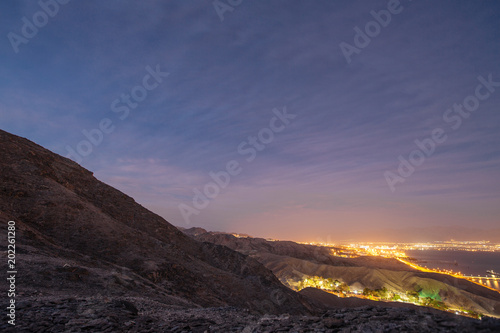 Suburb of Eilat city in the desert in the Israil in the evening with blue sky and city lights