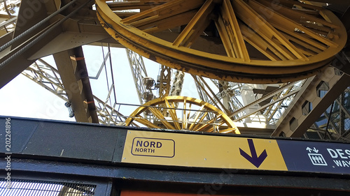 Paris, France, The Eiffel Tower mechanism, close up of two giant wheels turning, elevator pulleys
