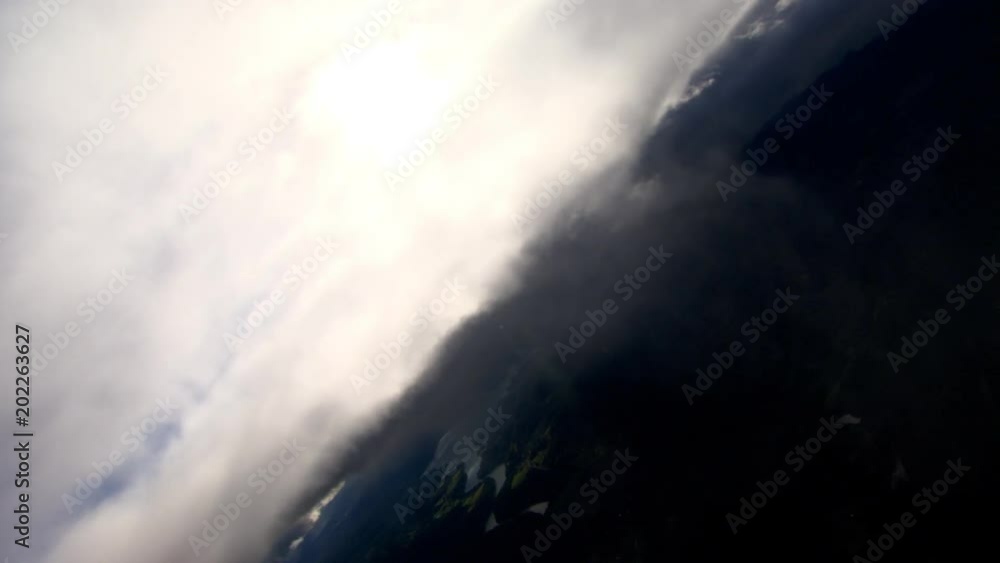 Steeply tilting flight through gray clouds Steeply tilting flight through gray clouds