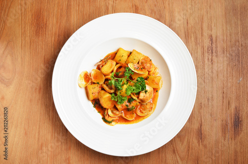 Italian gnocchi with tomato sauce and seafood 