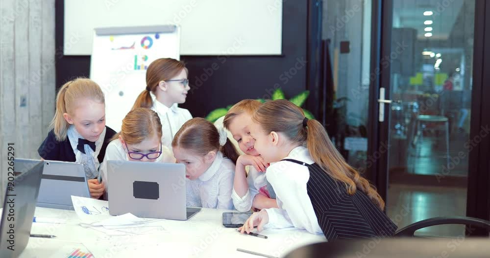 Meeting of business children in a modern office Meeting of business children in a modern office