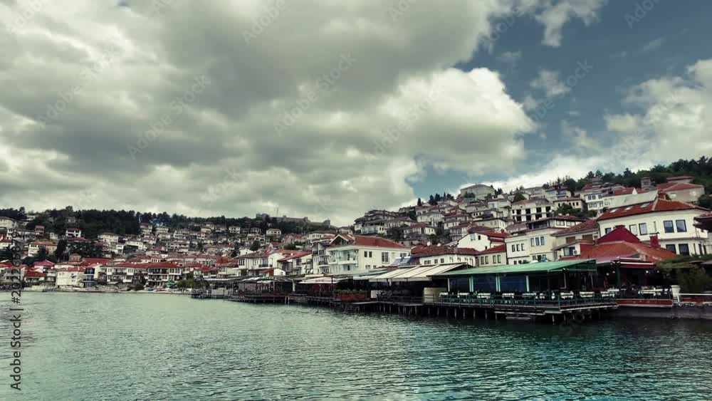Beautiful seaside view of Ohrid town from the Ohrid lake. Ohrid is famous for its unesco listed historical center and beautiful lake separating Macedonia from Albania Beautiful seaside view of Ohrid town from the Ohrid lake. Ohrid is famous for its unesco listed historical center and beautiful lake separating Macedonia from Albania