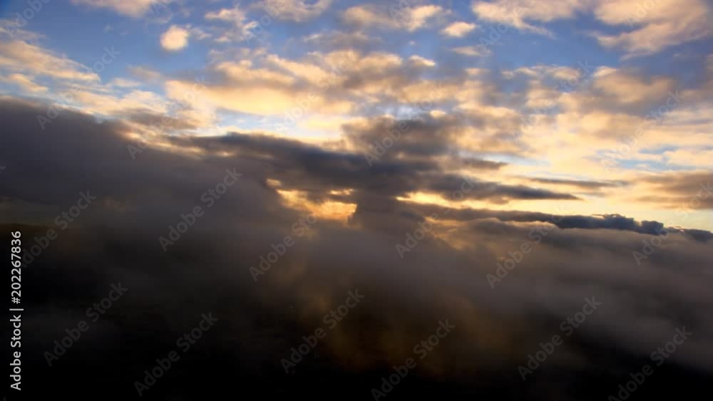 Flying through drifting clouds, precipitation on lens Flying through drifting clouds, precipitation on lens
