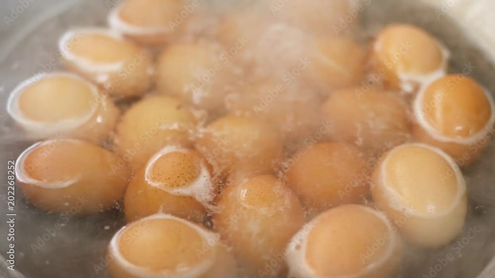 Close up boiled eggs in pan with hot water Close up boiled eggs in pan with hot water
