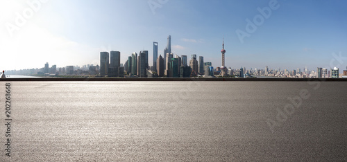 Empty road surface floor with city landmark buildings of panorama