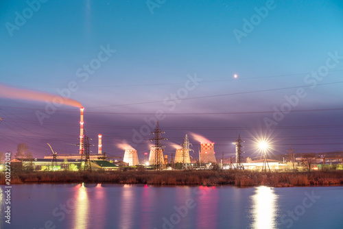 Thermal power plant reflecting in the lake