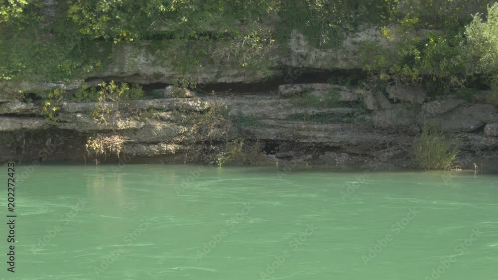 The rocky shore of Neretva river in Mostar The rocky shore of Neretva river in Mostar