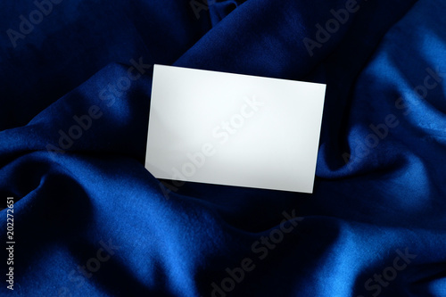 Fototapeta Naklejka Na Ścianę i Meble -  Navy blue silk and white paper. Theme for luxurious classic. Start idea for everything design
