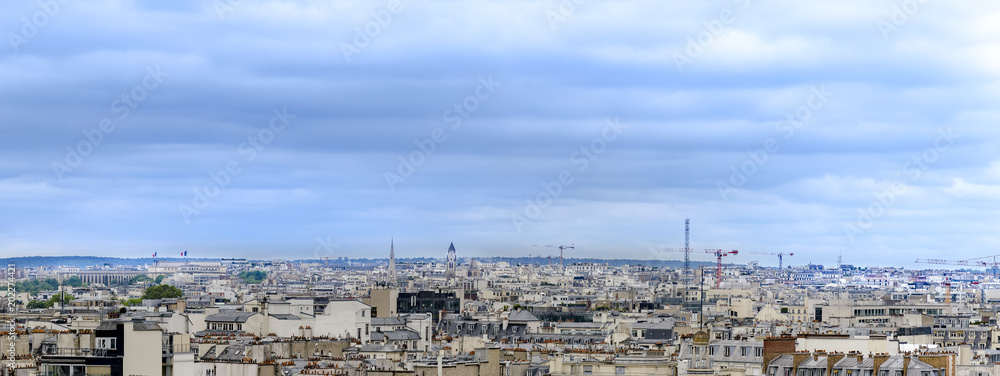 Fototapeta premium Aerial panorama of Paris skyline over building roofs