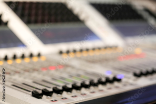 Blur of Equipment for sound mixer control  in studio TV station, Audio and Video Production Switcher of Television Broadcast.