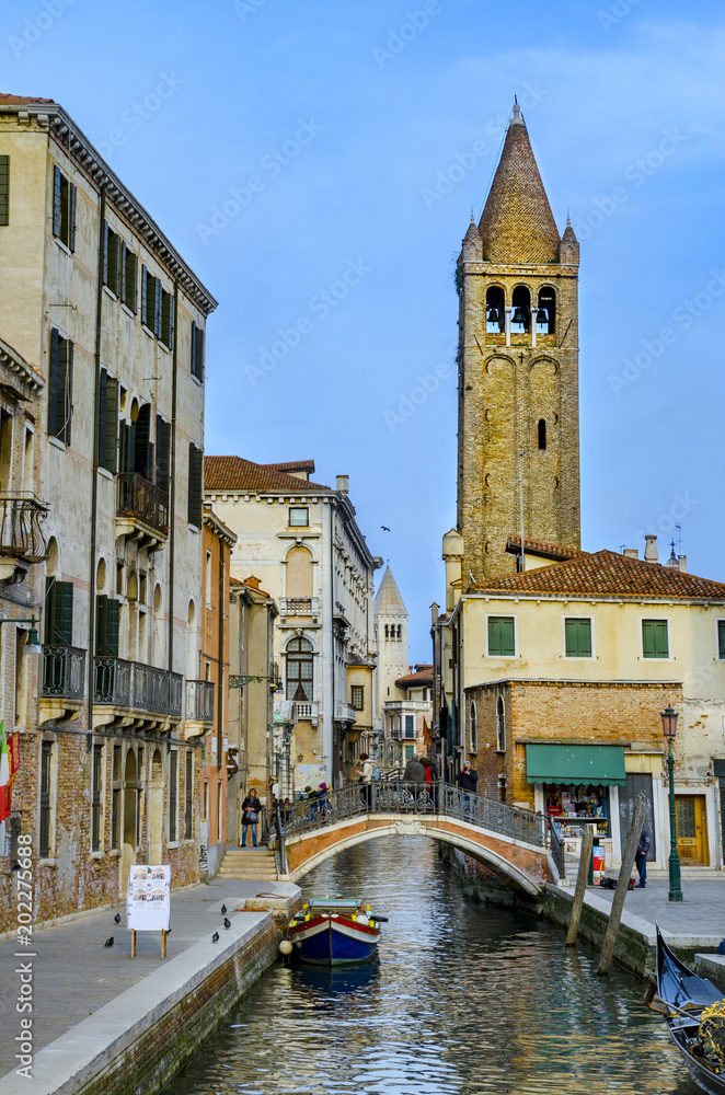 VENICE, ITALY - circa MARCH, 2016: Typical Venice canal with the church of San Barnaba, with local and tourists, in Venice, Veneto, Italy