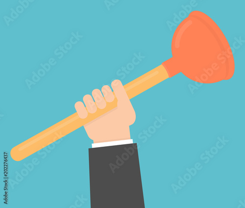 Hand holding sink plunger