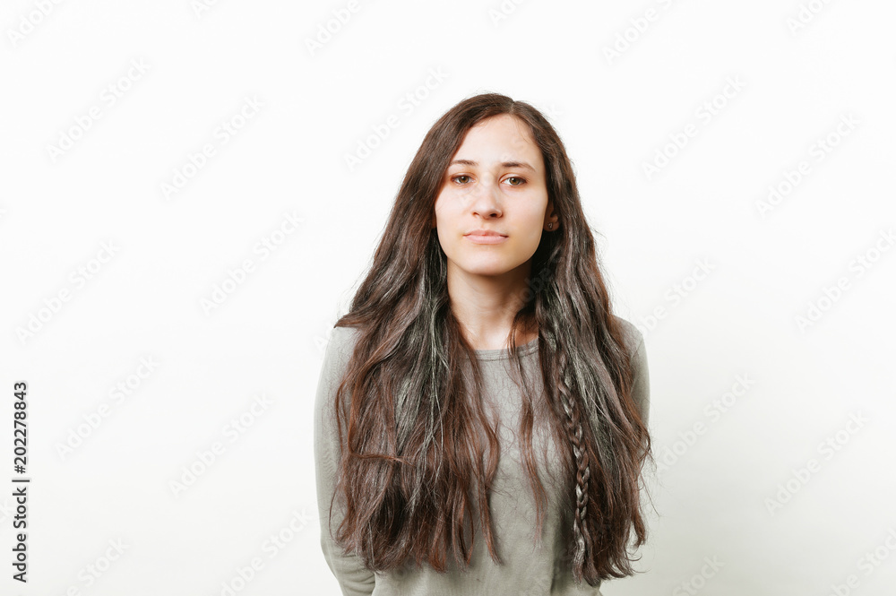 Portrait of confident young hipster woman with long hair isolated on white Portrait of confident young hipster woman with long hair isolated on white