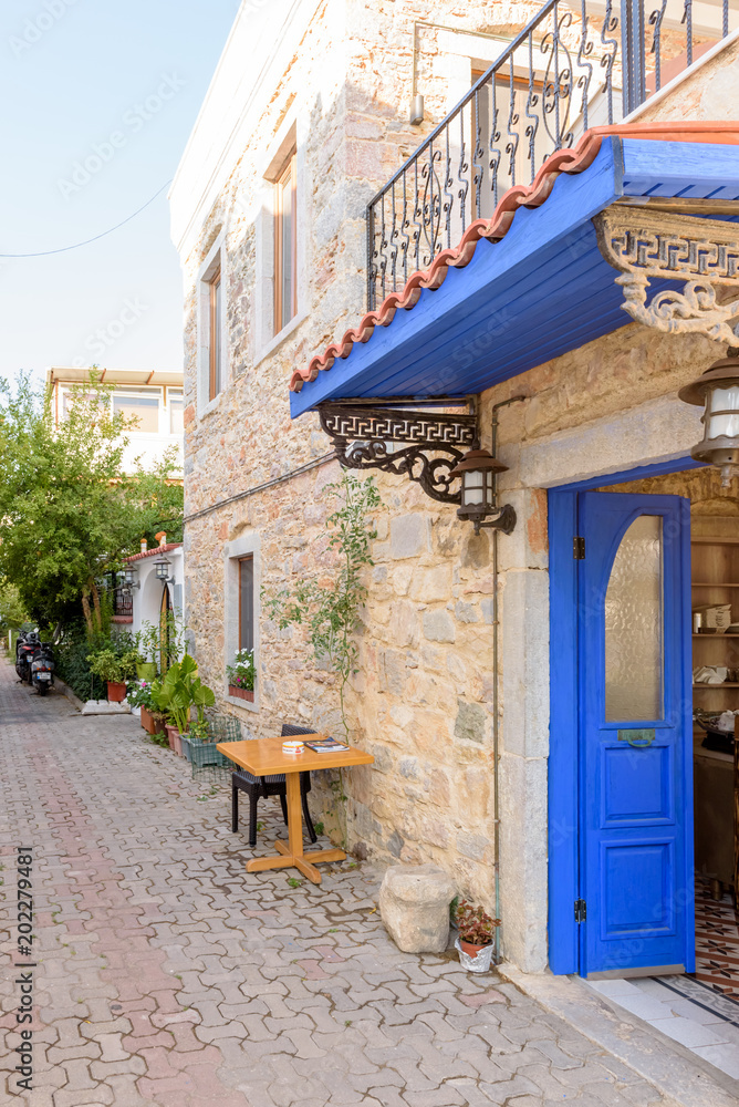 Narrow streets of Bodrum  with cafe table and chairs