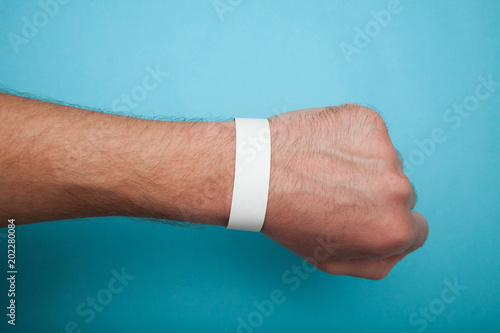 Mockup paper white bracelet on the arm.