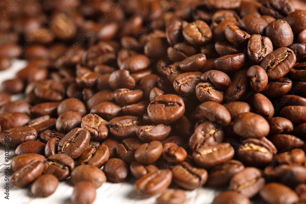 Extreme close up of roasted coffee beans pile Extreme close up of roasted coffee beans pile